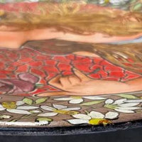 Assiette en terre cuite peinte du début du XXe siècle