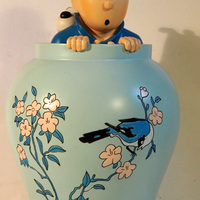 Figurine tintin dans la potiche