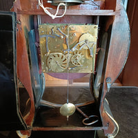 Horloge murale ancienne aux finitions noires et dorées