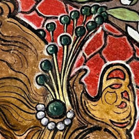 Assiette en terre cuite peinte du début du XXe siècle