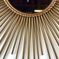 Miroir Soleil Chaty Vallauris en métal doré Années 1950-1960